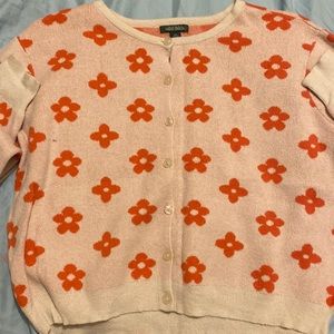 This sweater may look big but it is a stretchy material so it can fit all sizes.